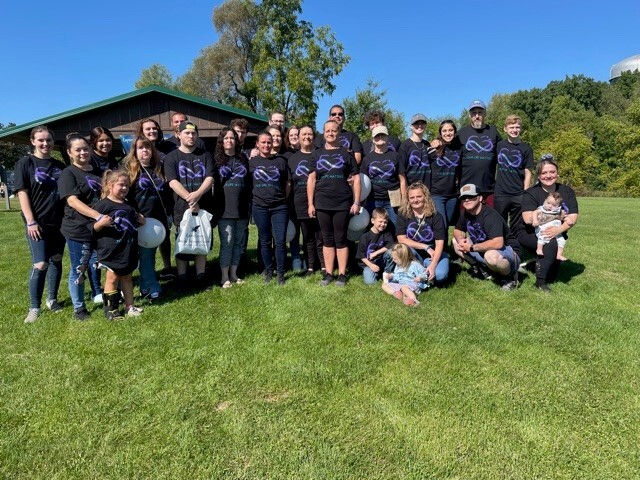 A large group of friends and family scattered across southeastern Michigan gathered at Rowden Park for the Into the Light Suicide Awareness Walk.